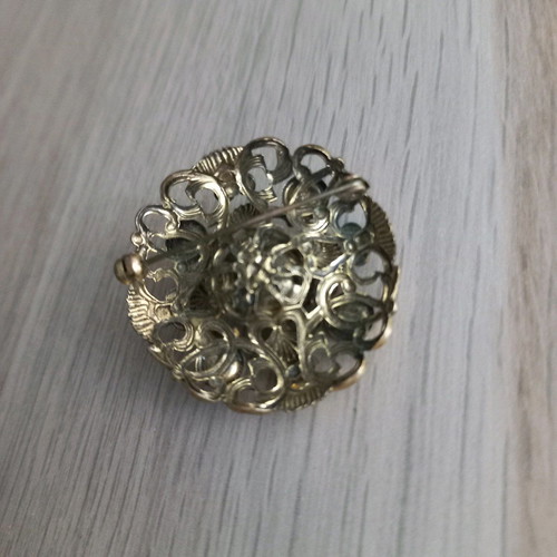Traditional old brooch with stone
