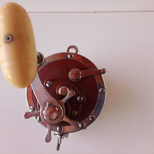 Penn Senator 114H fishing reel with large set of unused artificial lures and soft baits
