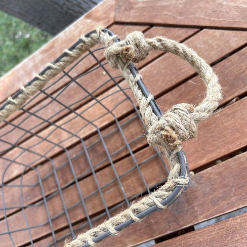 Boho style decorative basket with natural rope handles