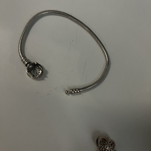 Pandora bracelet 17cm like new with charm, clasp repair needed