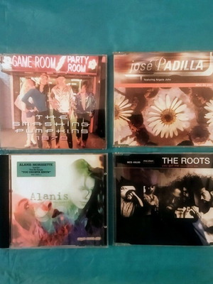 CD set of 4 used with Alanis, The Roots, José Padilla, Smashing Pumpkins