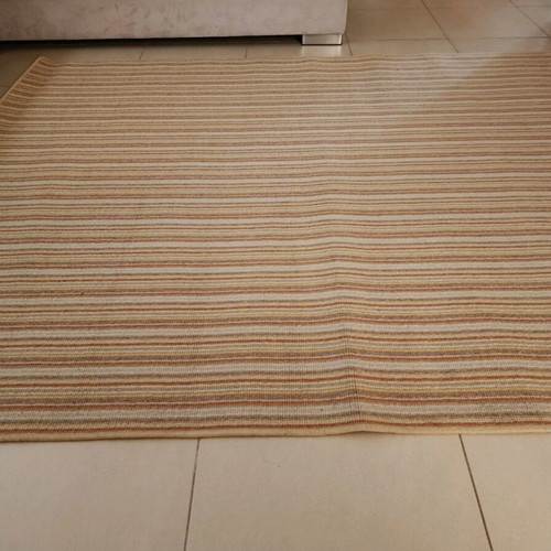 Used rug with beige, mustard, brown and terracotta stripes