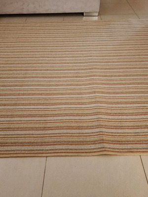 Used rug with beige, mustard, brown and terracotta stripes