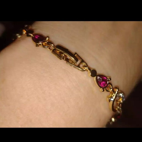 Bracelet with rubies and crystals new, gold and pink