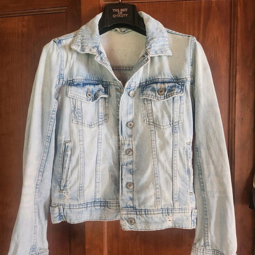 Denim jacket refurbished with upcycled design