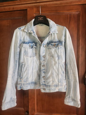 Denim jacket refurbished with upcycled design