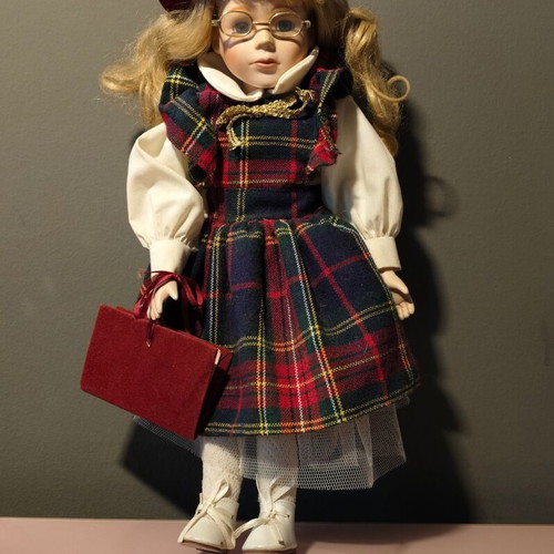 Porcelain doll used in music teacher role