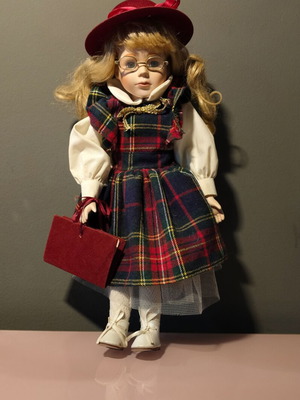 Porcelain doll used in music teacher role