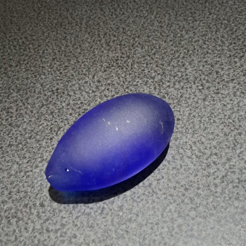 Vintage decorative crystal egg with blue matte glass and gold metal base used