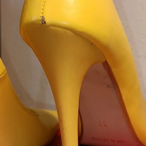 Yellow pumps used, size 37 with minor wear