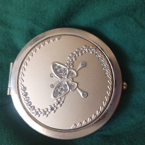 Compact mirror with gold-tone metal case and butterfly decoration, like new