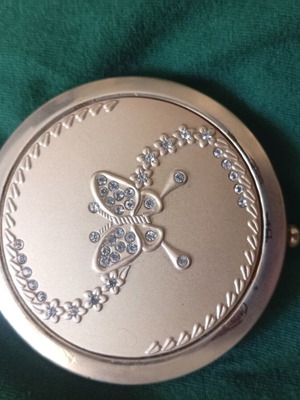 Compact mirror with gold-tone metal case and butterfly decoration, like new