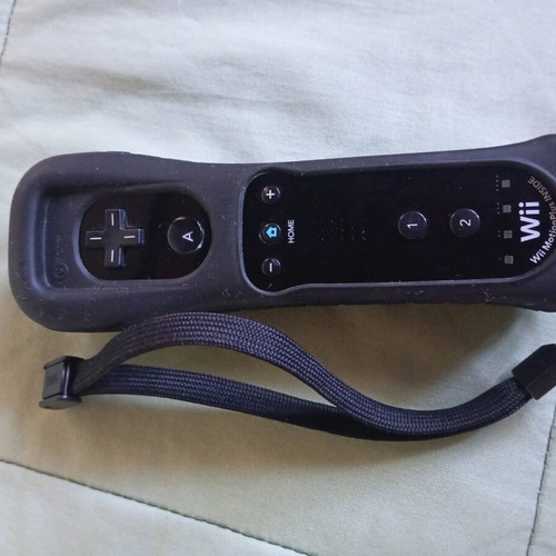 Nintendo Wii black used with Wii Motion Plus controller, nunchuk and 2 games