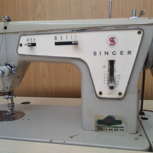 Singer sewing machine in cabinet used, functional