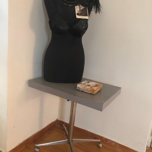 Industrial side table used with adjustable height and visible marks