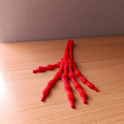 Articulated hand new, 3D printed, red PLA