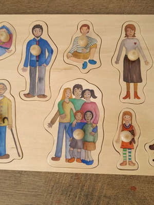 Wooden family puzzle with pegs like new