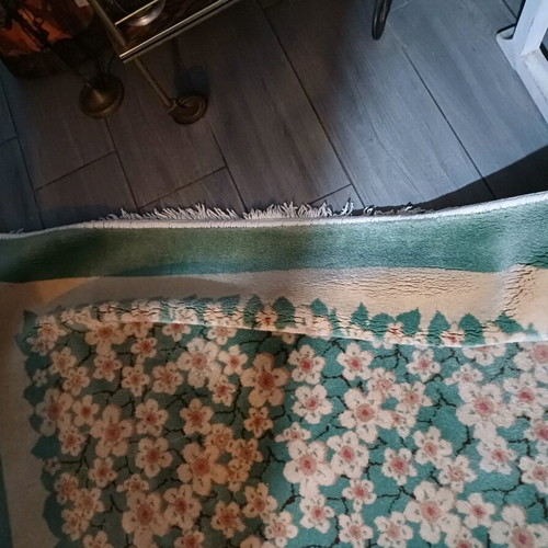 Rug 2.00x3.00 like new with mint-colored almond blossoms