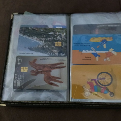 Collectible old phone cards used with album