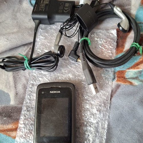 Nokia C2-05 phone with charger, headphones and data cable