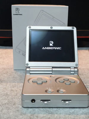 Anbernic RG35XXSP handheld console with 64GB micro SD and tempered glass
