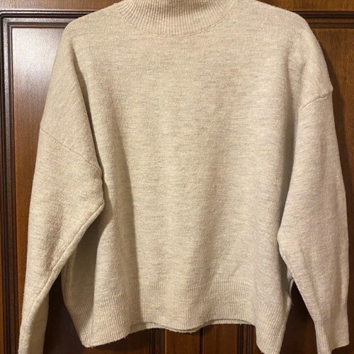 Beige pullover like new, large fits small and medium