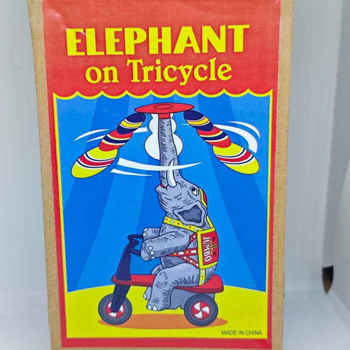 Vintage metal elephant on tricycle like new