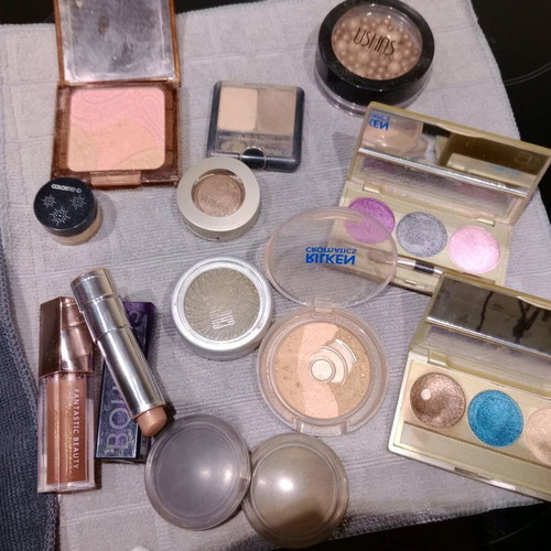Cosmetics set used with eyeshadows, blushes, lipstick, and lip gloss