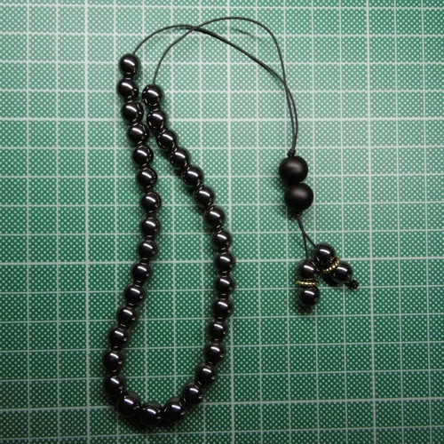 Handmade komboloi with hematite beads and acrylic priest beads