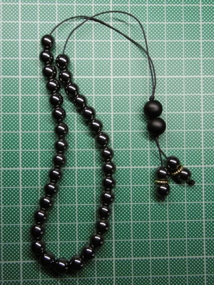 Handmade komboloi with hematite beads and acrylic priest beads