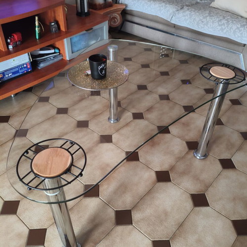 Glass coffee table with metal legs