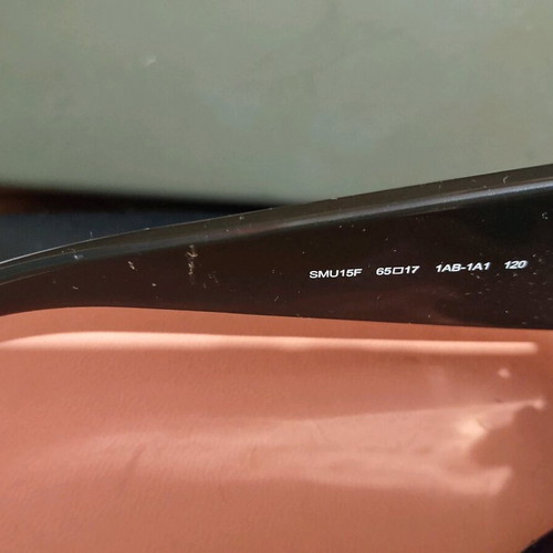 Miu Miu sunglasses used with case and cloth, black and gold