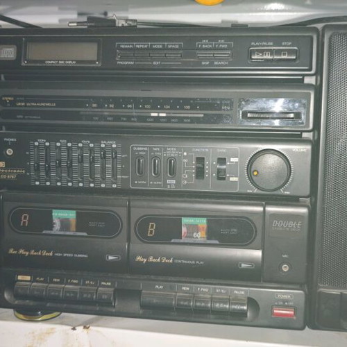Booster stereo system used, 90s style, removable speakers