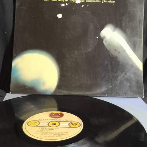 Adventures in Utopia vinyl record used, cover with tape