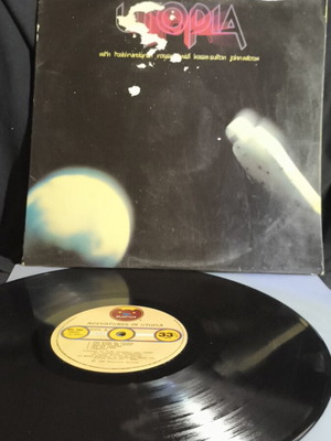 Adventures in Utopia vinyl record used, cover with tape