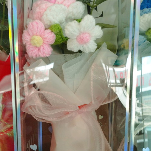 Artificial flower bouquet like new with knitted flower and plastic leaves