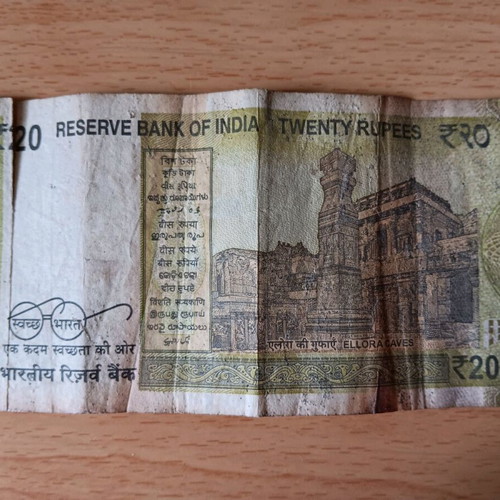 Indian 20 Rupees banknote used with tear