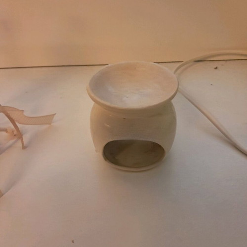 Clay container for liquid room fragrance used