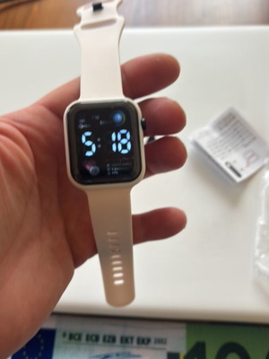 Electronic wristwatch new, white, analog