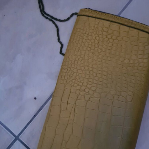 Mustard clutch bag used with minor damages