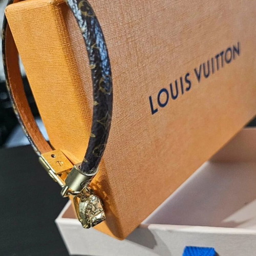 Louis Vuitton leather bracelet with gold plated backpack charm