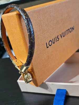 Louis Vuitton leather bracelet with gold plated backpack charm