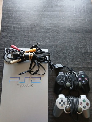 PlayStation 2 Silver used, fully functional with light scratches
