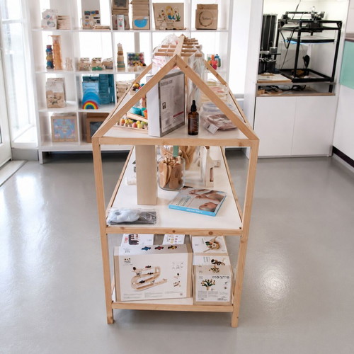 Wooden house-shaped display shelf for store