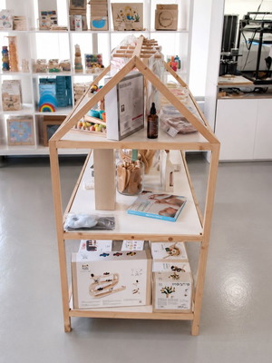 Wooden house-shaped display shelf for store