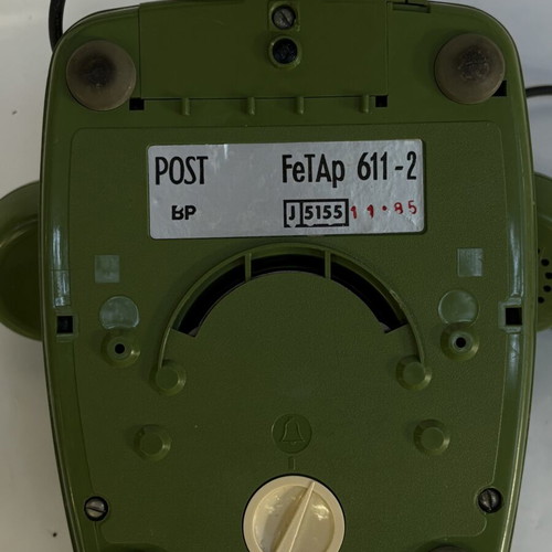 Vintage green telephone used, wired connection