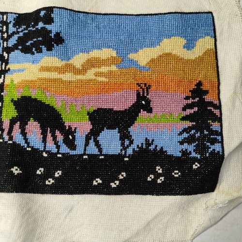 Vintage embroidery landscape with deer and sunset used