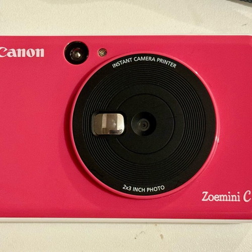 Canon Zoemini C camera used, pink Polaroid-style with internal battery repair needed