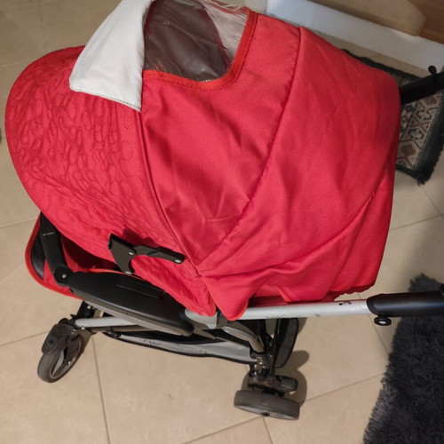 Kiddo Smart Deluxe stroller used with footmuff and changing bag, red