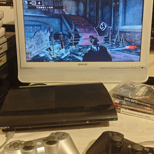 PlayStation 3 Super Slim console 1TB with controllers and games